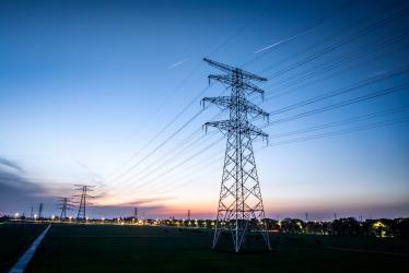 Landscape with high-voltage electricity pylons