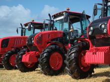 Tractors lined up in a field